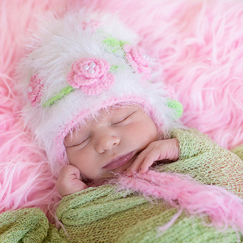 White hat with pink/pearl flowers